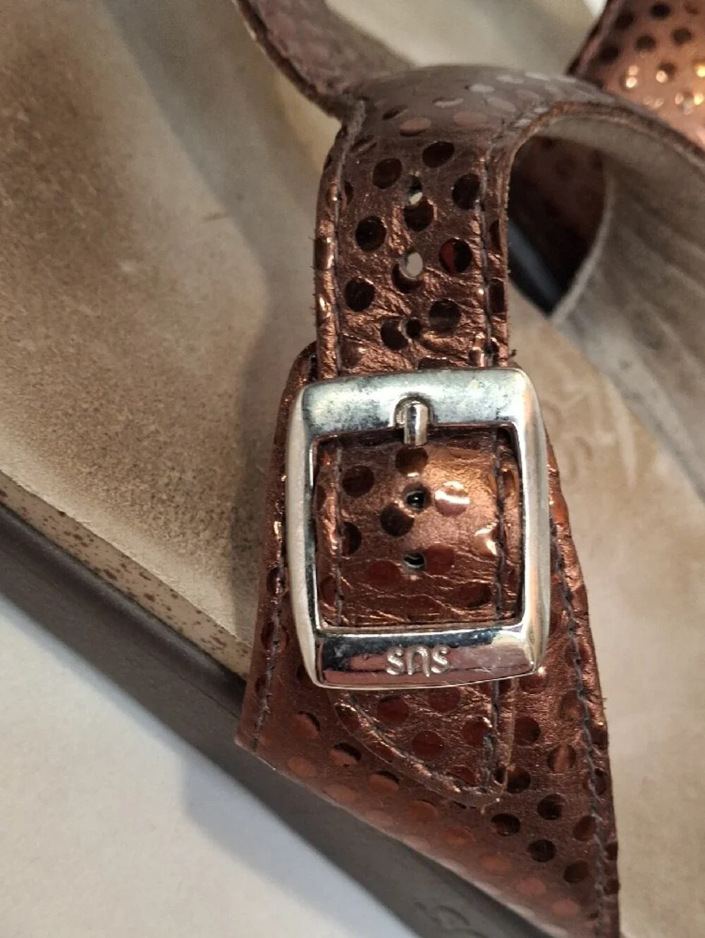 SAS Sanibel Metallic Bronze Gold Thong T Strap Sandals with Gold Buckle Detail.